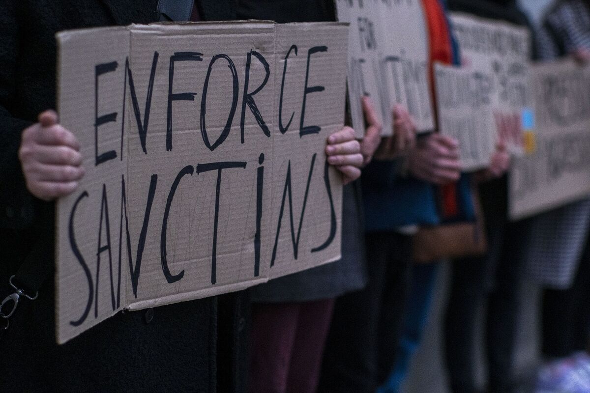 A man protests in front of the Ministry of Foreign Affairs on February 21, 2022, in Kyiv. The protest in support of applying sanctions on Russia immediately drew a very small amount of participants.Even though the capital Kyiv, is now said to be a potential target of Russia, most people are ignoring much of what is happening on the global stage.Does Anyone Care?