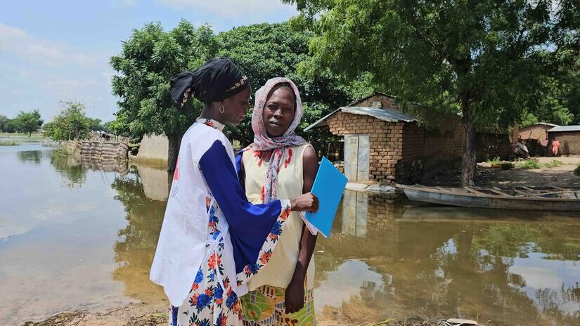 cameroon_red_cross_volunteer_adama_barka_comforts_woman_.jpeg