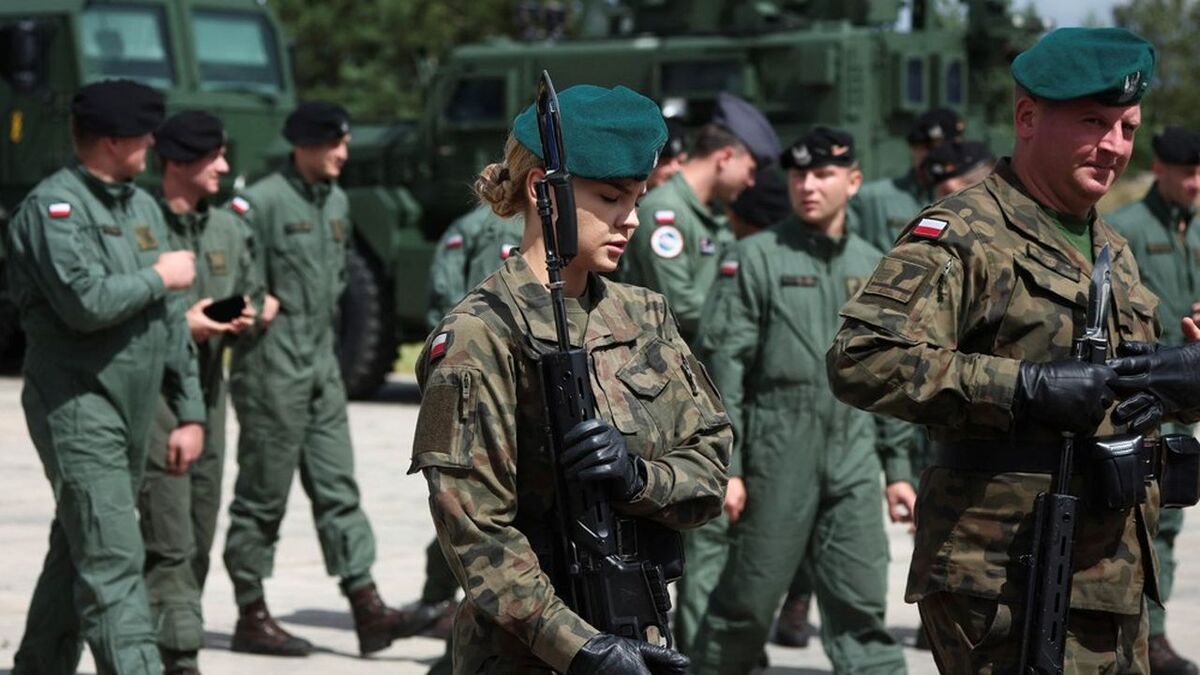 Polish soldiers walk after a news conference, a week before the National Army Day Parade, at Wesola military base in Warsaw, Poland, August 8, 2023. REUTERS/Kacper Pempel