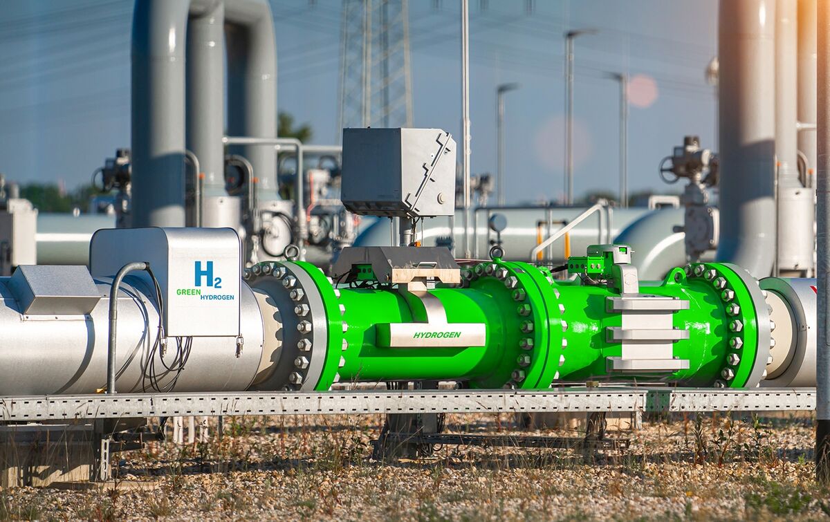 Green Hydrogen renewable energy production pipeline - green hydrogen gas for clean electricity solar and windturbine facility.