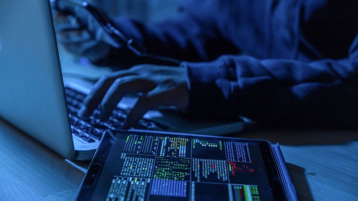 Payments System Hacking. Online Credit Cards Payment Security Concept. Hacker in Black Gloves Hacking the System.