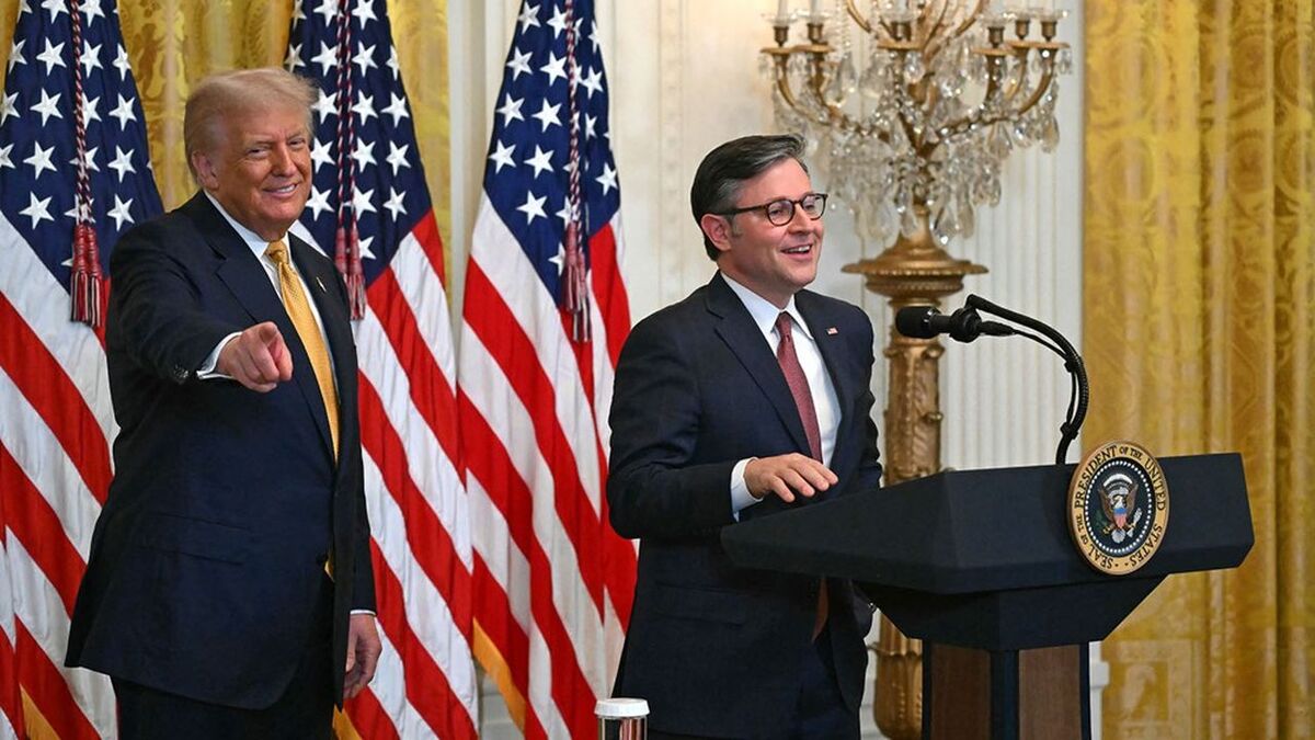 US Speaker of the House Mike Johnson (R) speaks alongside US President Donald Trump during a reception with Republican members of Congress at the White House in Washington, DC on July 22, 2025. (Photo by ANDREW CABALLERO-REYNOLDS / AFP)