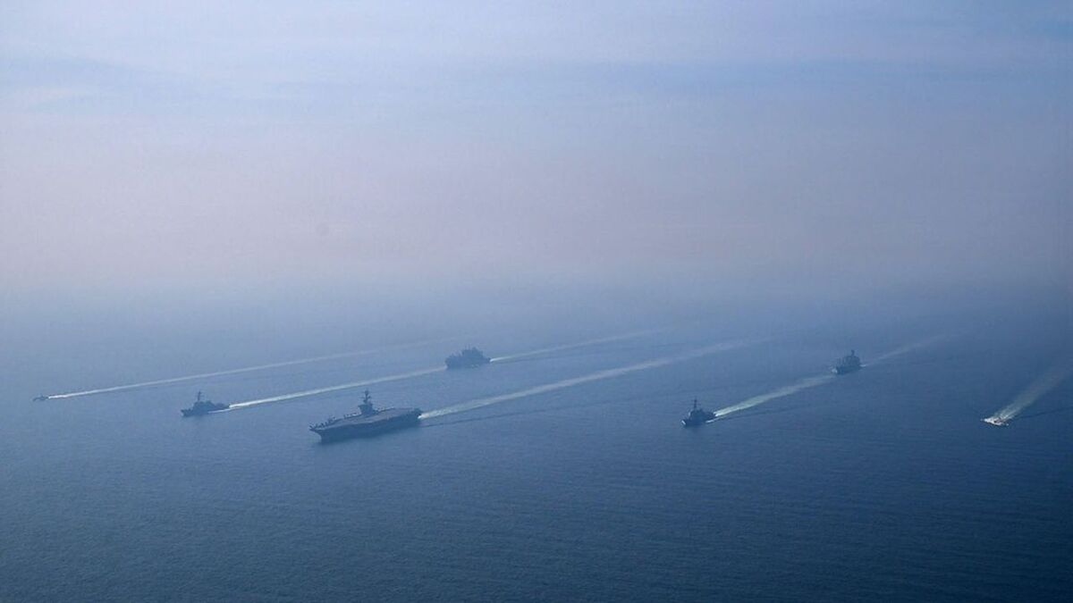The U.S. Navy's Nimitz-class aircraft carrier USS Abraham Lincoln leads its strike group during a photo exercise in the Arabian Sea, February 6, 2026.  U.S. Navy/Mass Communication Specialist 1st Class Jesse Monford/Handout via REUTERS THIS IMAGE HAS BEEN SUPPLIED BY A THIRD PARTY    