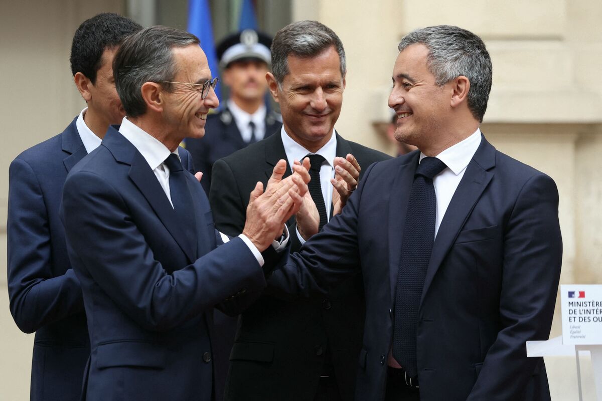 French newly-named Minister of the Interior Bruno Retailleau (Front L), French newly-named Delegate Minister for Everyday Security Nicolas Daragon (C) and French newly-named Secretary of State for Citizenship and Fight against Discriminations Othman Nasrou (Rear L) applaud France's outgoing Minister for Interior and Overseas Gerald Darmanin after he delivered a speech during the handover ceremony at the Interior ministry in Paris, on September 23, 2024. (Photo by Alain JOCARD / AFP)