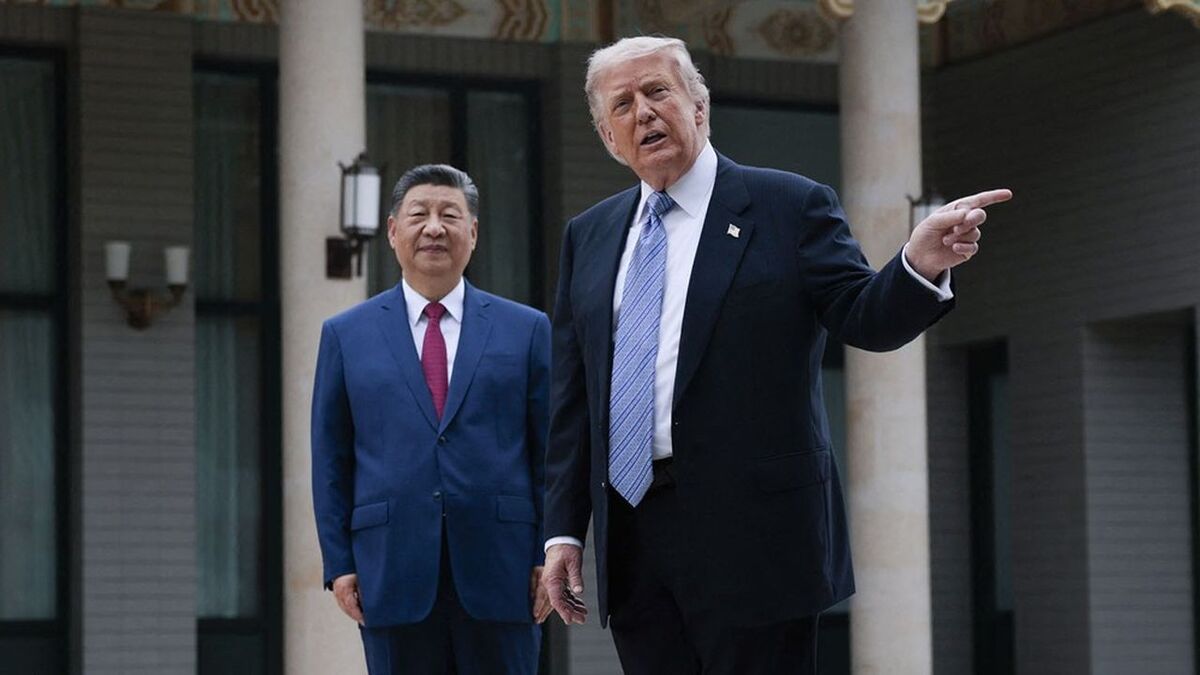 US President Donald Trump (R) gestures as he poses for photos with China’s President Xi Jinping during a visit to Zhongnanhai Garden in Beijing on May 15, 2026. (Photo by Evan Vucci / POOL / AFP)