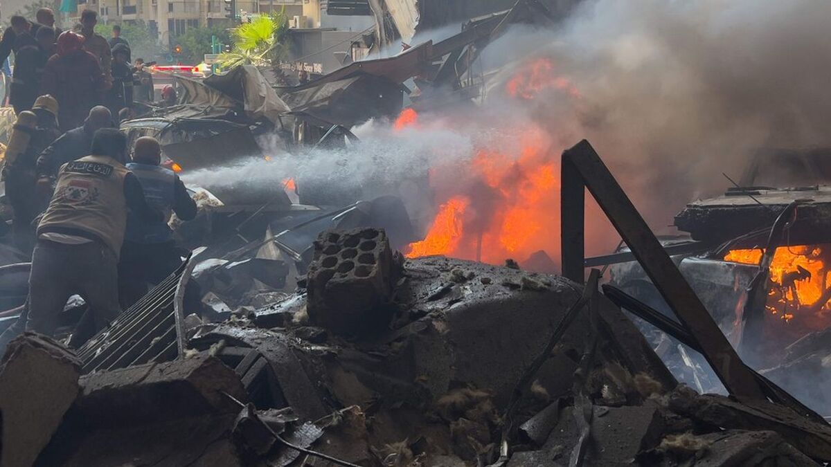 Firefighters extinguish burned cars at the site of an Israeli airstrike in central Beirut, Lebanon, Wednesday, April 8, 2026. (AP Photo/Hussein Malla)/XHM119/26098508378635//2604081613