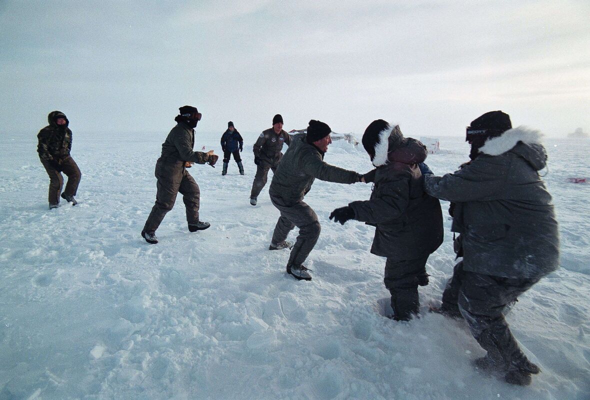 Mandatory Credit: Photo by Rob Schoenbaum/ZUMA Press Wire/Shutterstock (15107706an)Greenland: US Air Force aircrew at Camp Rvaen on the Greenland icecap for training in arctic survival going in for an impromtu game of arctic football. An autonomous territory which remains part of the Denmark, Greenland, situated in teh North Atlantic between Canada and Iceland, has a huge landmass of 2.1+million square kilometers of which 81% is covered by a glacier some 2,300meters thick. Larger than Germany, the thin strip of habitable land hugging its circumfrence supports a popultion of only 56,421 (2021). With a per capita GDP at a largely subsistance level, the territory receives subsidies from Denmark and also from the European Union, even though it is not a member state. At the same time, it's estimated that Greenland has massive untapped natural resources in teh form of rare eath metals, nickel, gold, diamonds, iron, graphite, uranium, copper, not to mention oil.Greenland, Kangerlussuaq - 19 Jan 2025/shutterstock_editorial_Greenland_Kangerlussuaq_19_Ja_15107706an//2501191208