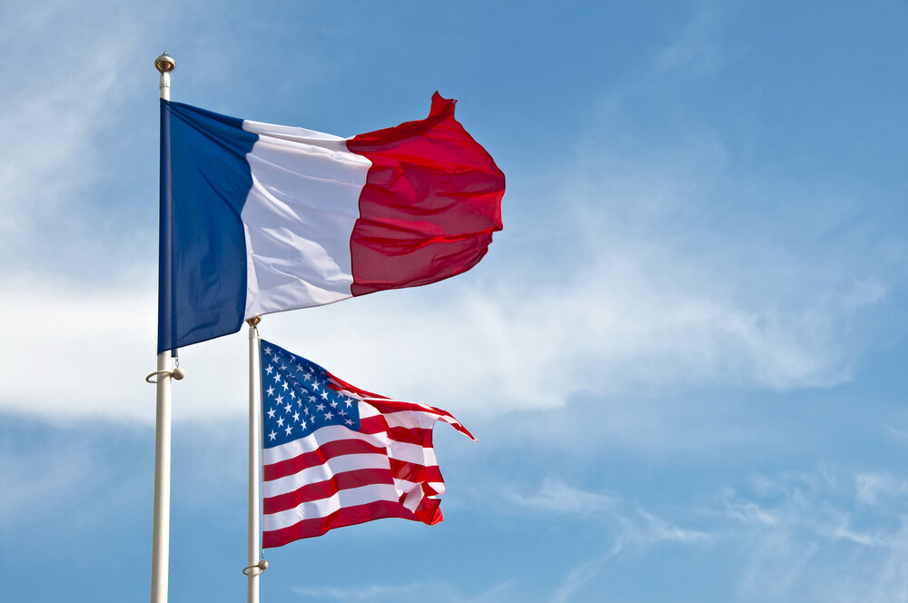 American and French flags in the sky